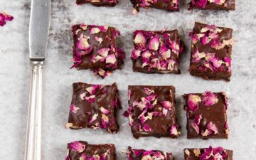 Slices of homemade rocky road decorated with rose petals