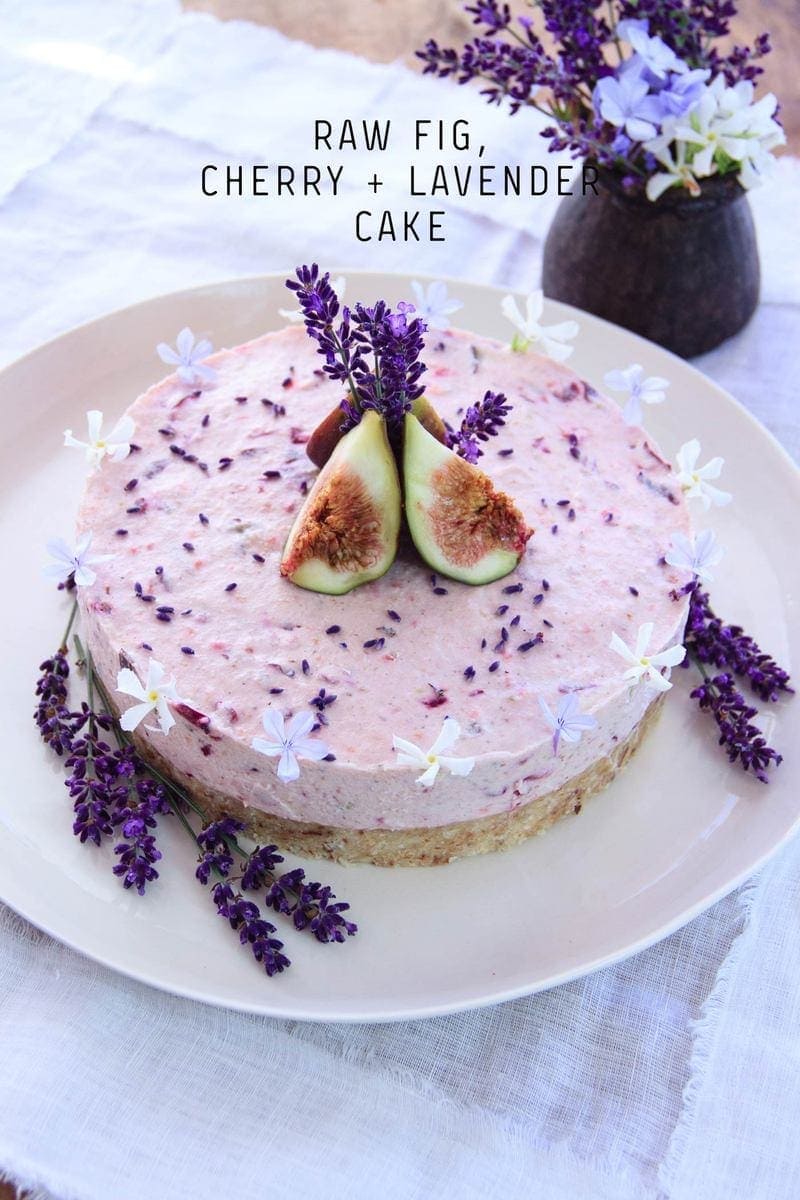 Impressive raw lavender cake decorated with flowers on a table