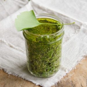 A mason jar full of pesto made from ginkgo leaves
