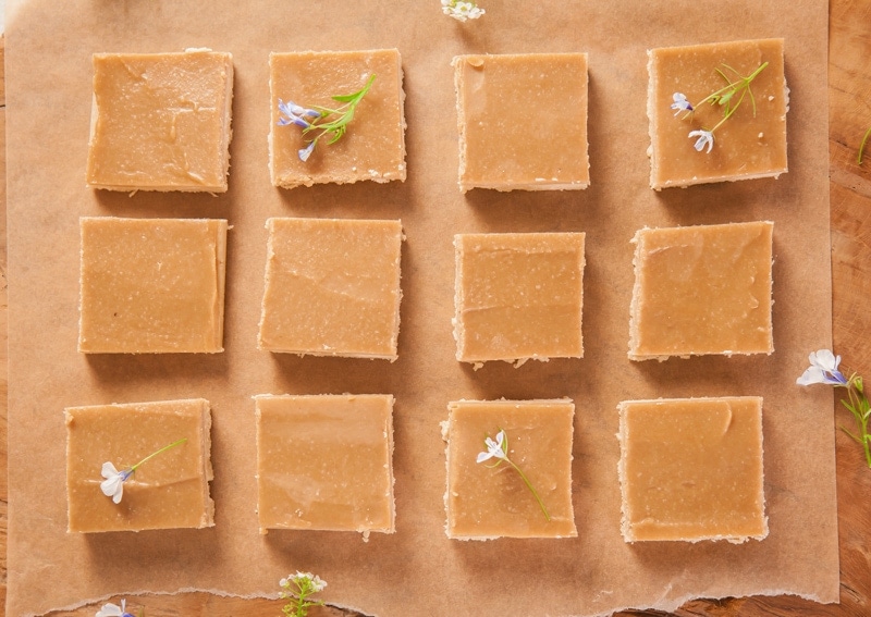 Close up of squares of ginger crunch arranged on a tray