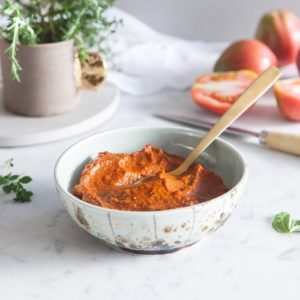 Thick and textured tomato sauce in a pretty ceramic bowl
