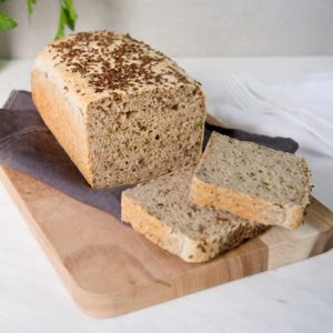 Home baked gluten free bread that has been sliced on the counter