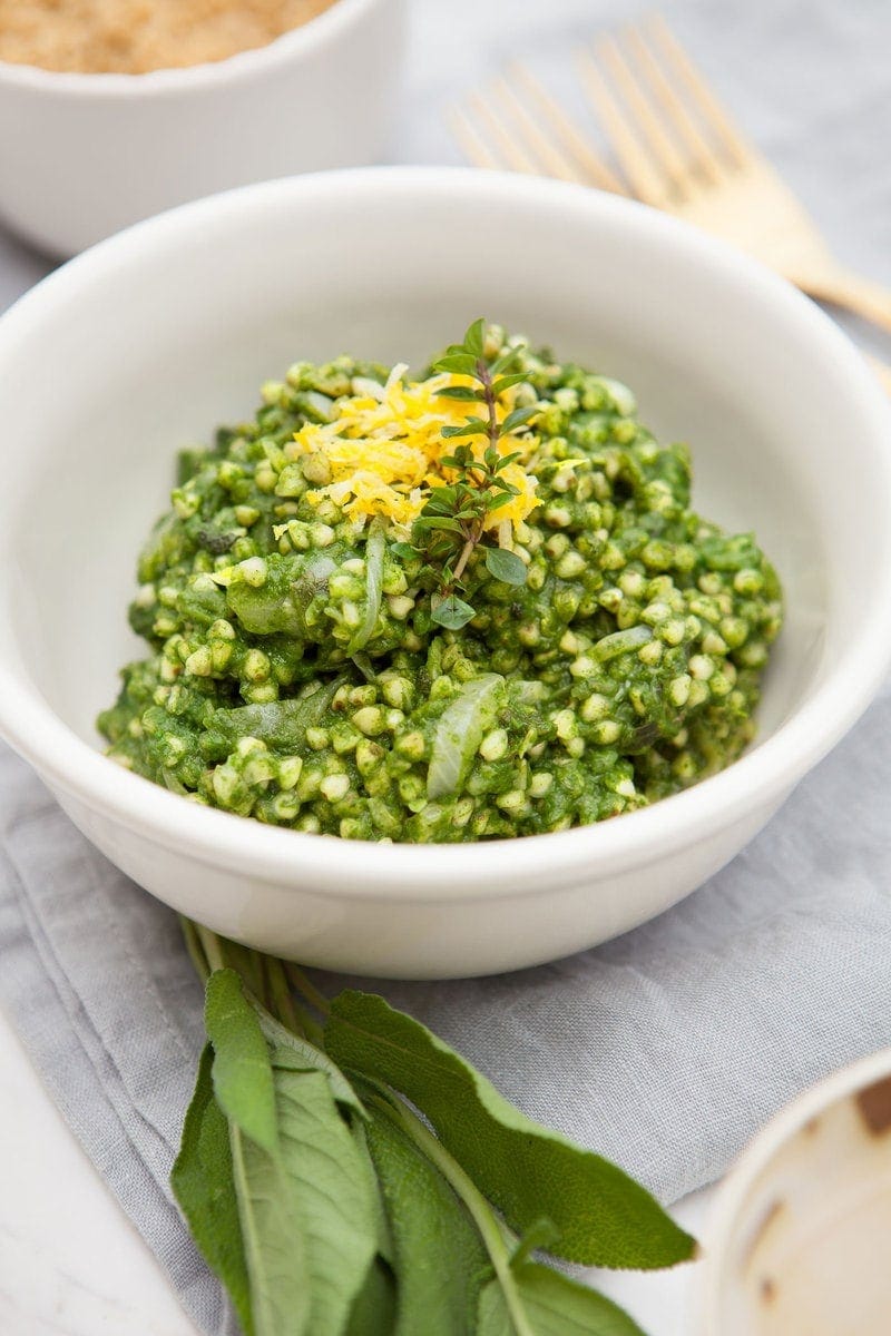 Creamy Spinach Buckwheat Risotto in bowl with a napkin ready to serve