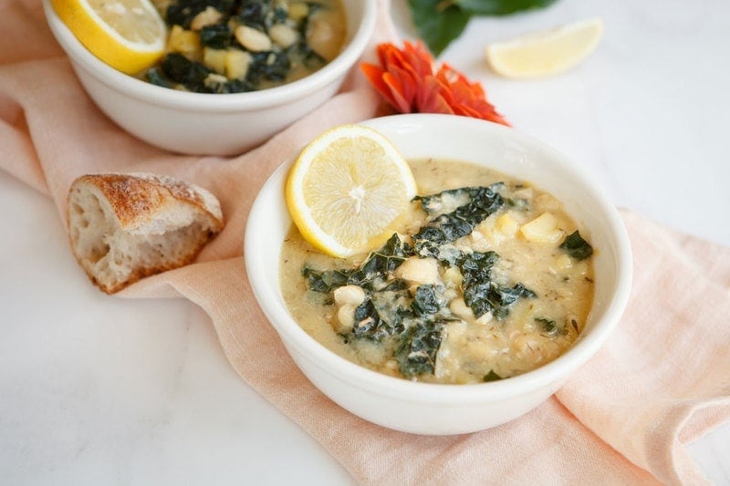 Soup presented on a marble counter.