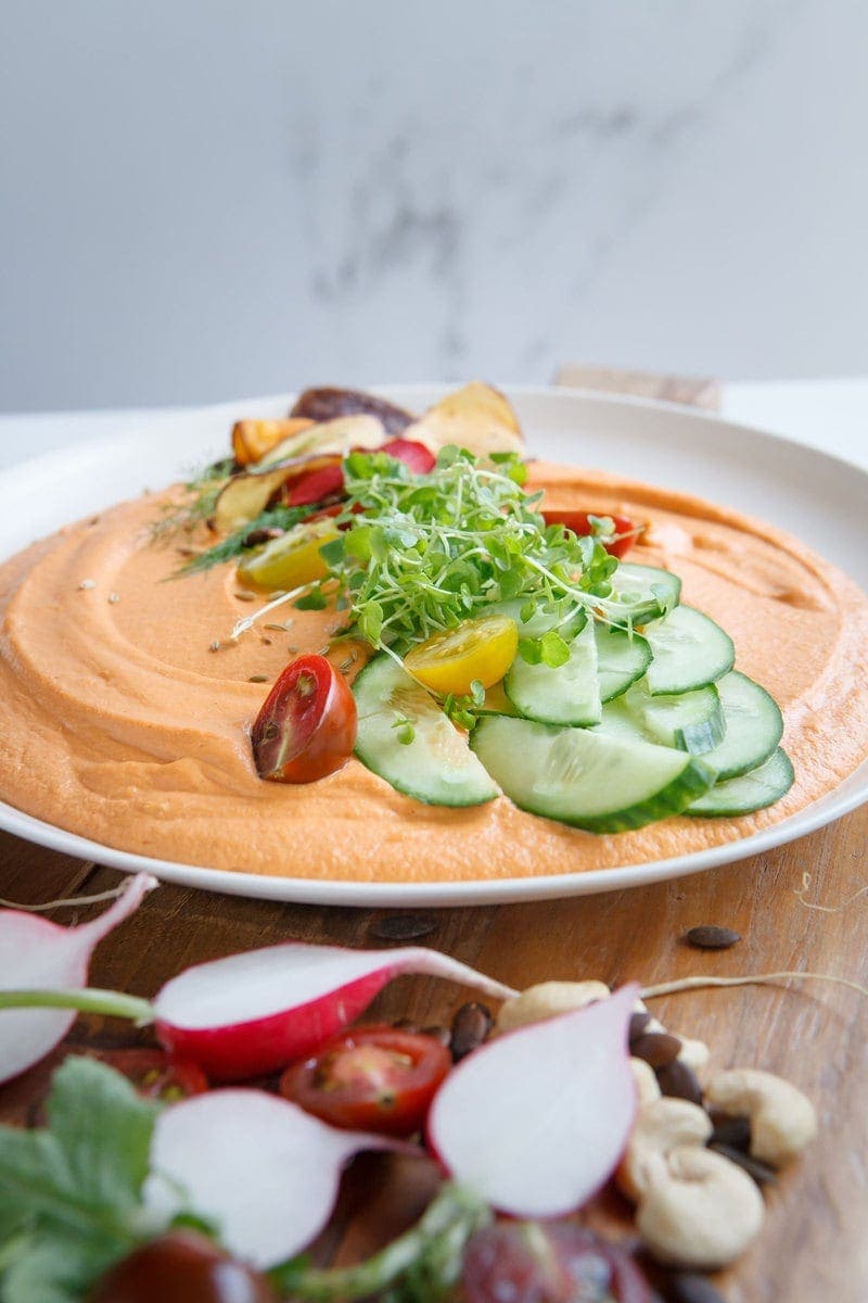 Chargrilled Capsicum Hummus with Cashews and Miso close up on a plate