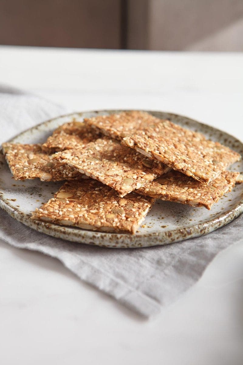 Side profile of Speedy Super Seed Crackers on a ceramic plate
