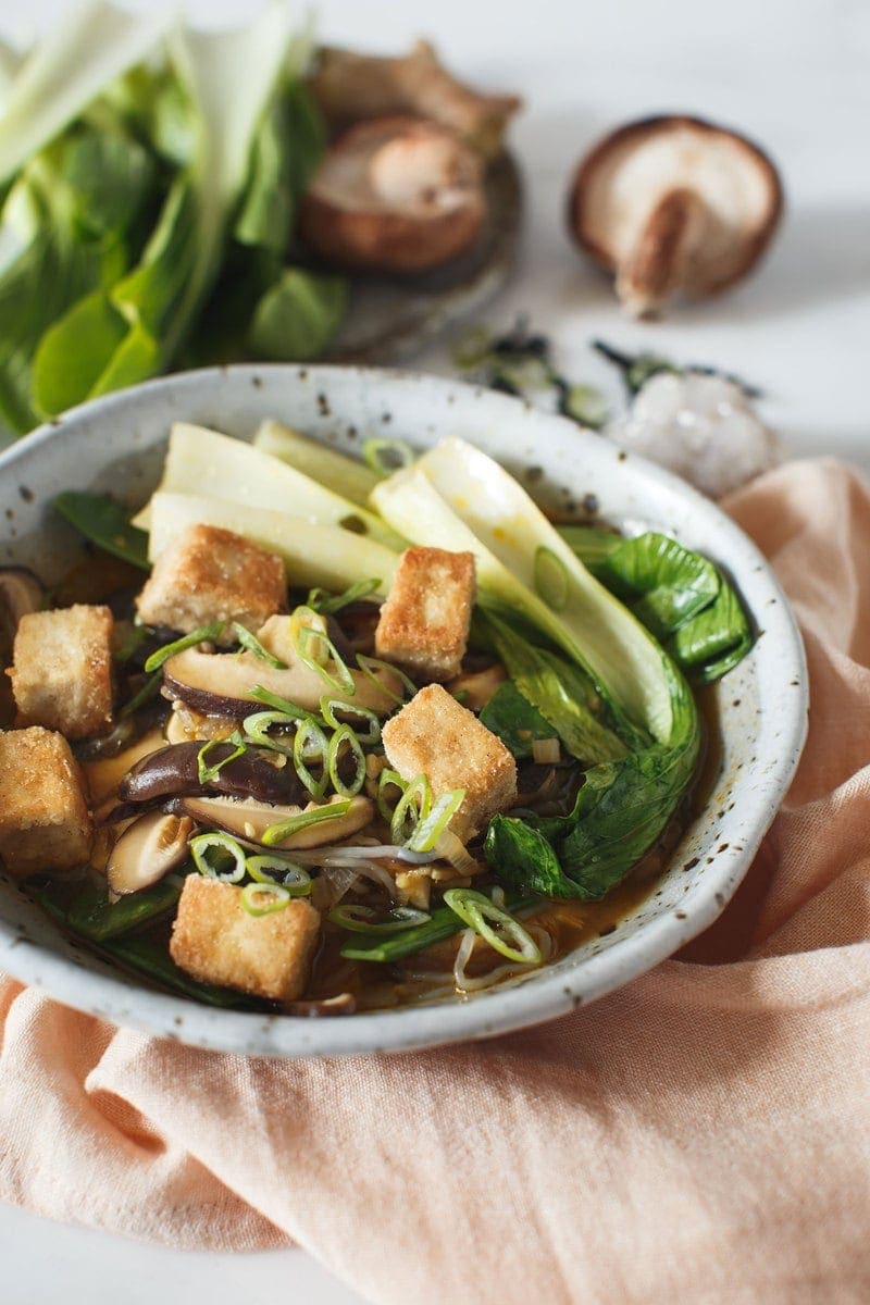 Shiitake Immuno-Soup in bowl, close up, garnished with scallions