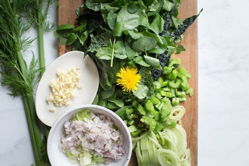 Close up of fresh watercress, dandelion, fennel and kale ready to make watercress soup