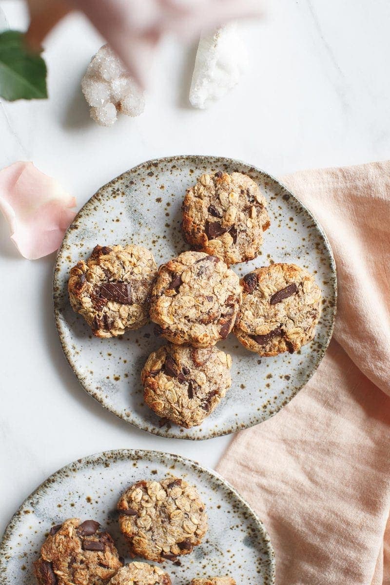 Homemade healthy chocolate apricot oat cookies on a plate on a marble counter