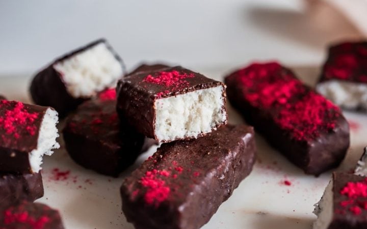 Close up of homemade bounty bars cut in half on a platter