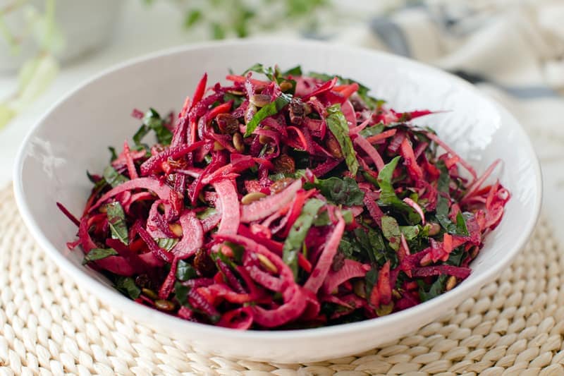 Freshly prepared raw beetroot salad in a bowl ready to serve with dinner