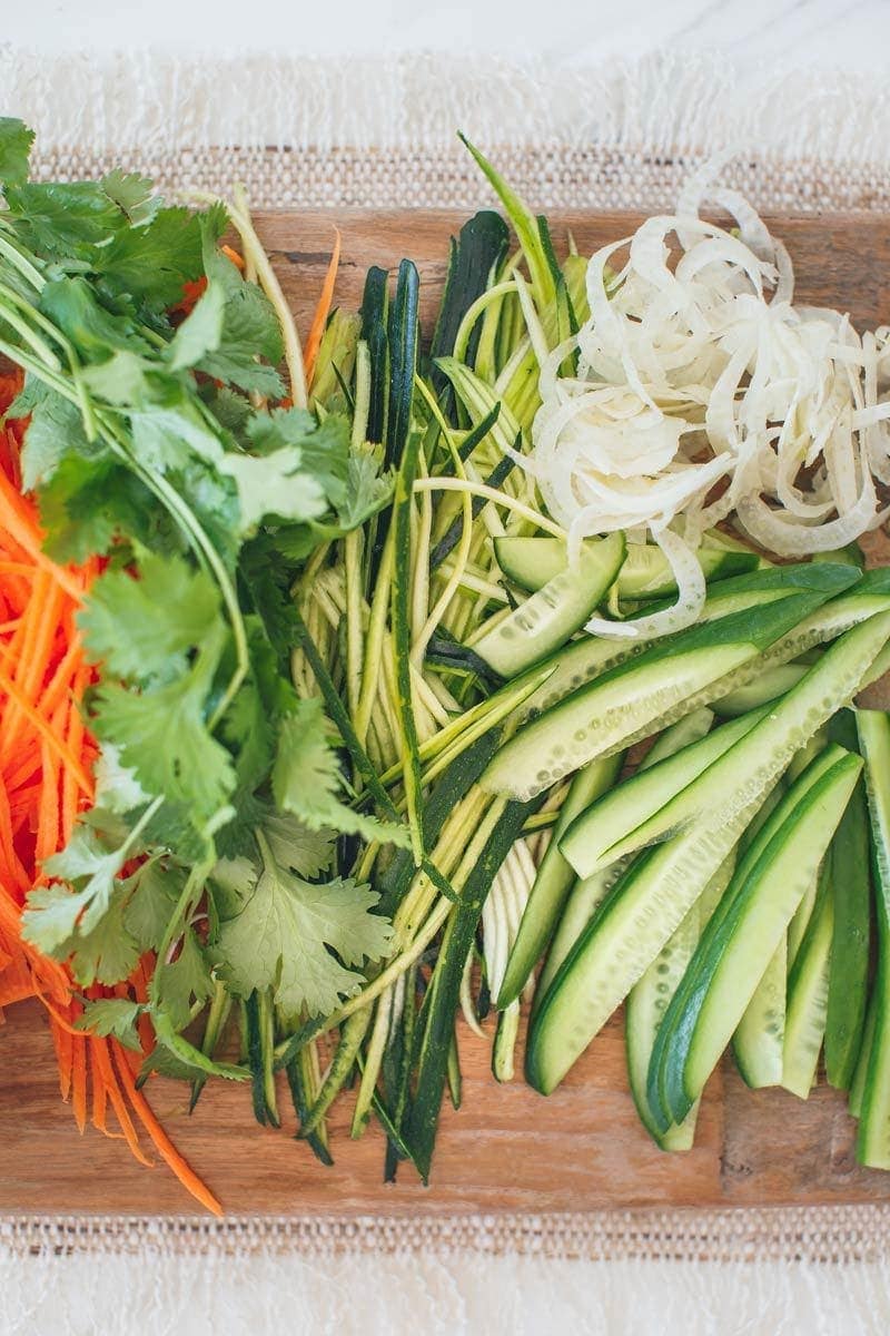 Close up of julienned vegetables on a chopping board