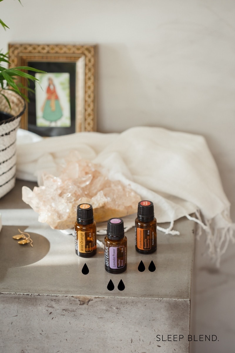 Essential oils for sleep and grounding on a beside concrete table