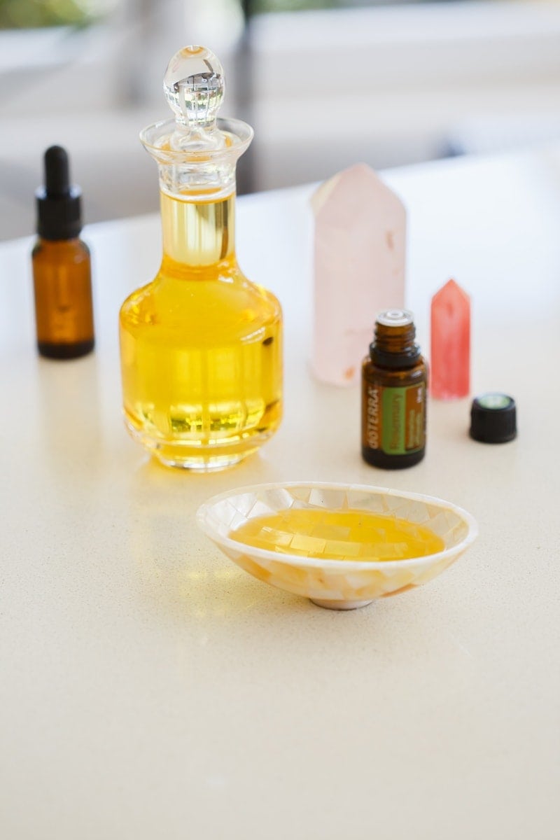Bottle of argan oil with rosemary essential oil to make a hair mask with