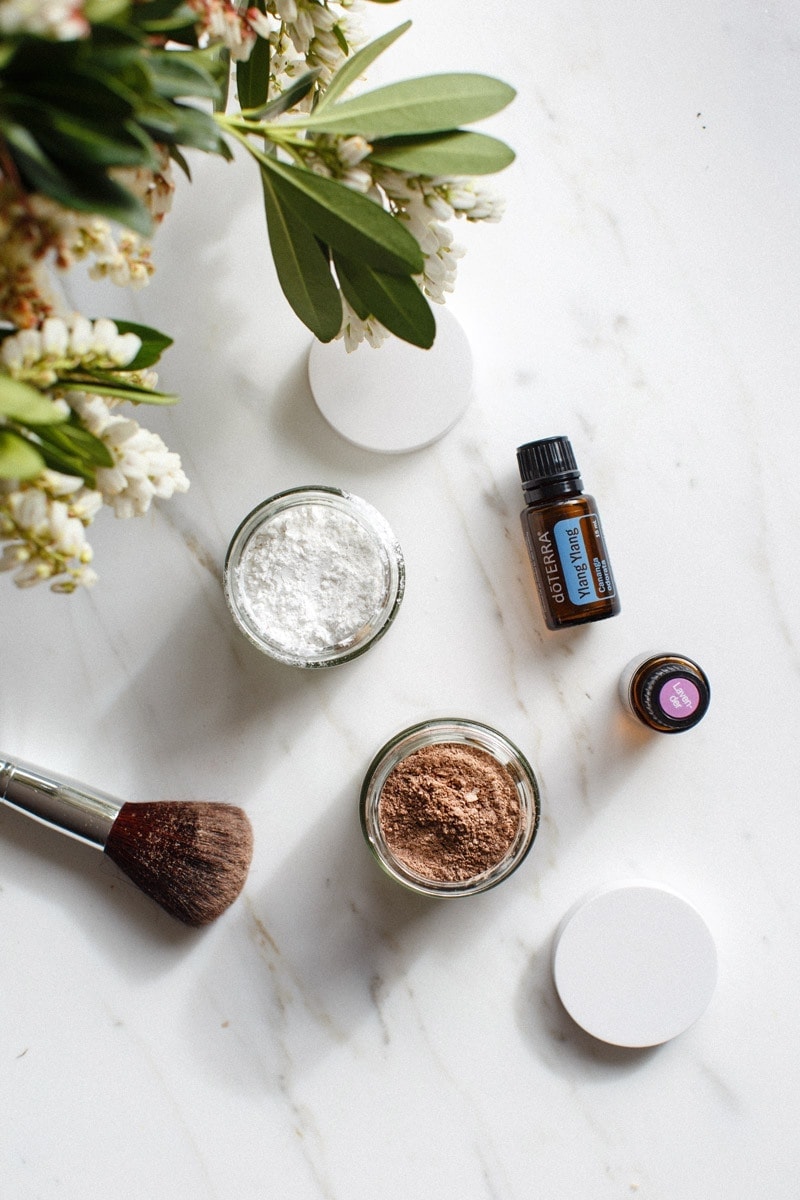 Jars of DIY dry shampoo made from arrowroot powder and essential oils