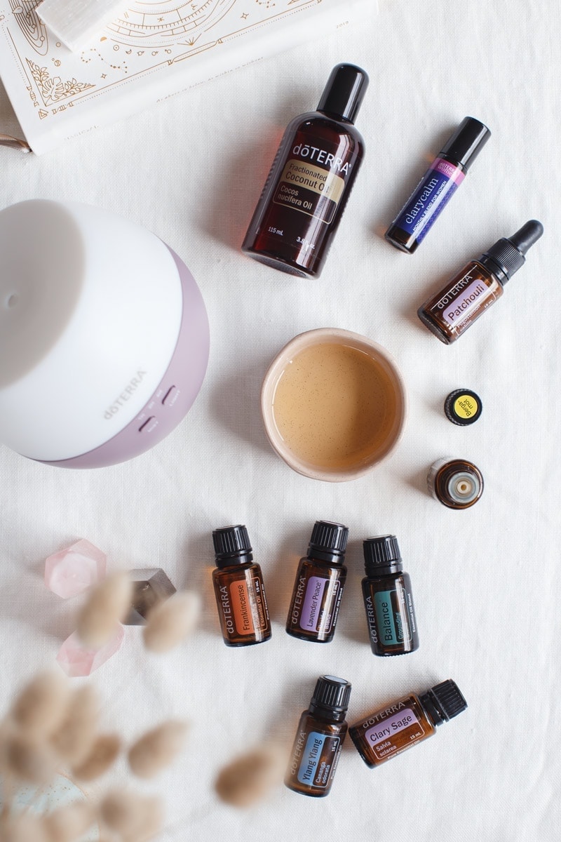 Flat lay of essential oils to balance hormones