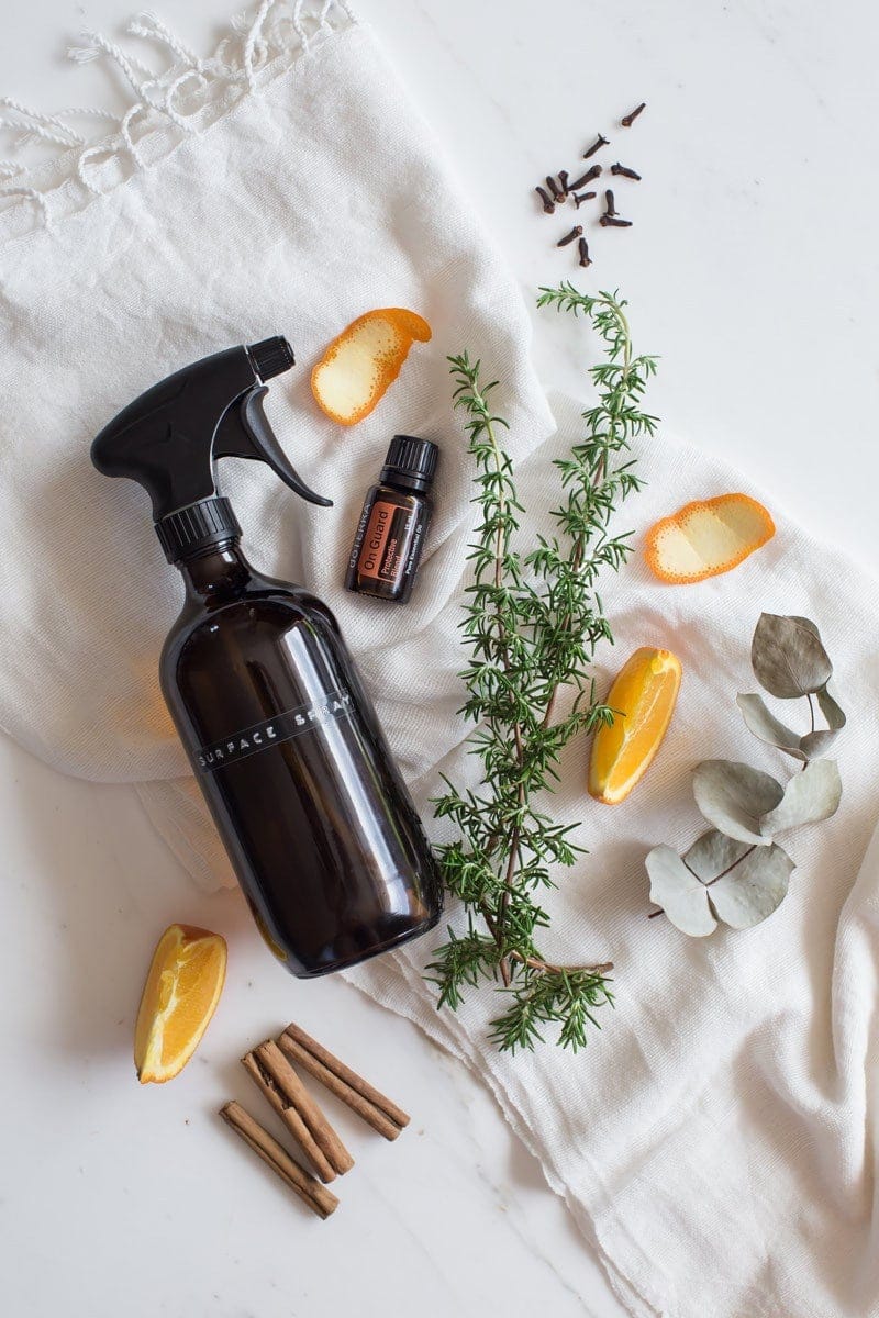 Hero shot of the all-purpose cleaner surrounded by key ingredients