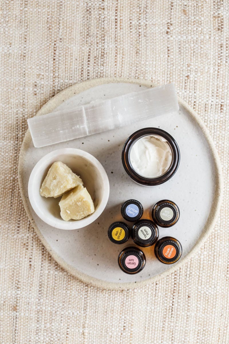 DIY face cream on a ceramic plate with essential oils