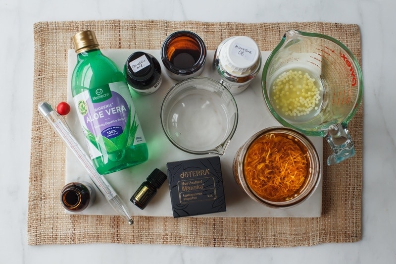 Ingredients and equipment for homemade face cream laid out on the table