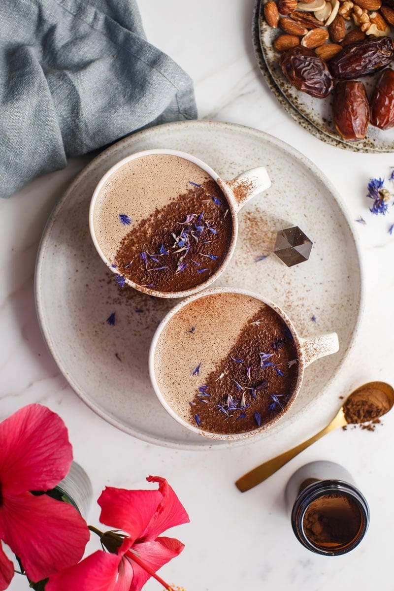 Two mugs of homemade chaga mushroom hot chocolate ready to enjoy
