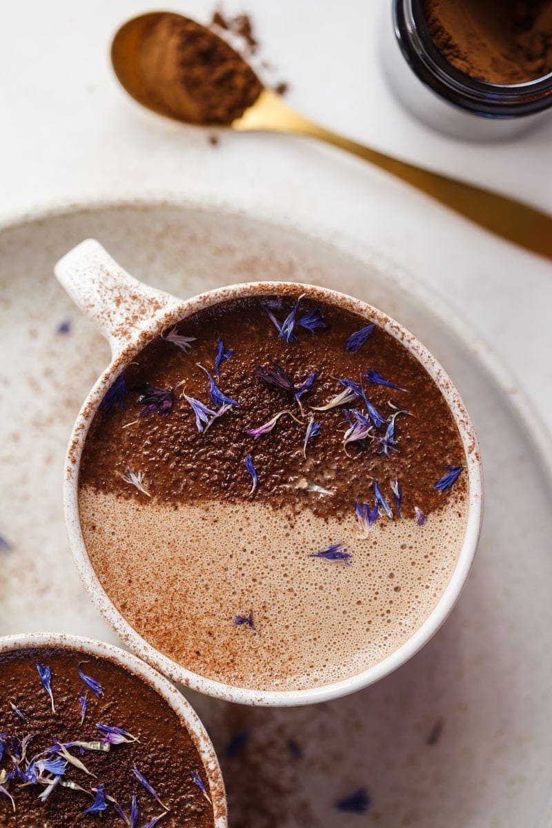 Close up of a frothy cup of chaga mushroom hot chocolate