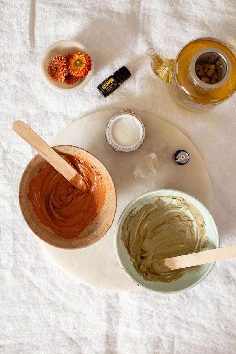 Red and green clay masks prepared side by side