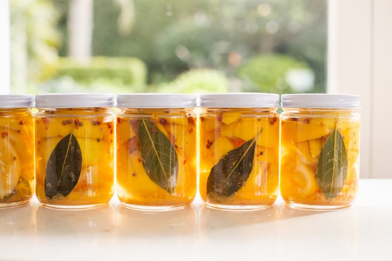 Jars of preserved lemons by the window