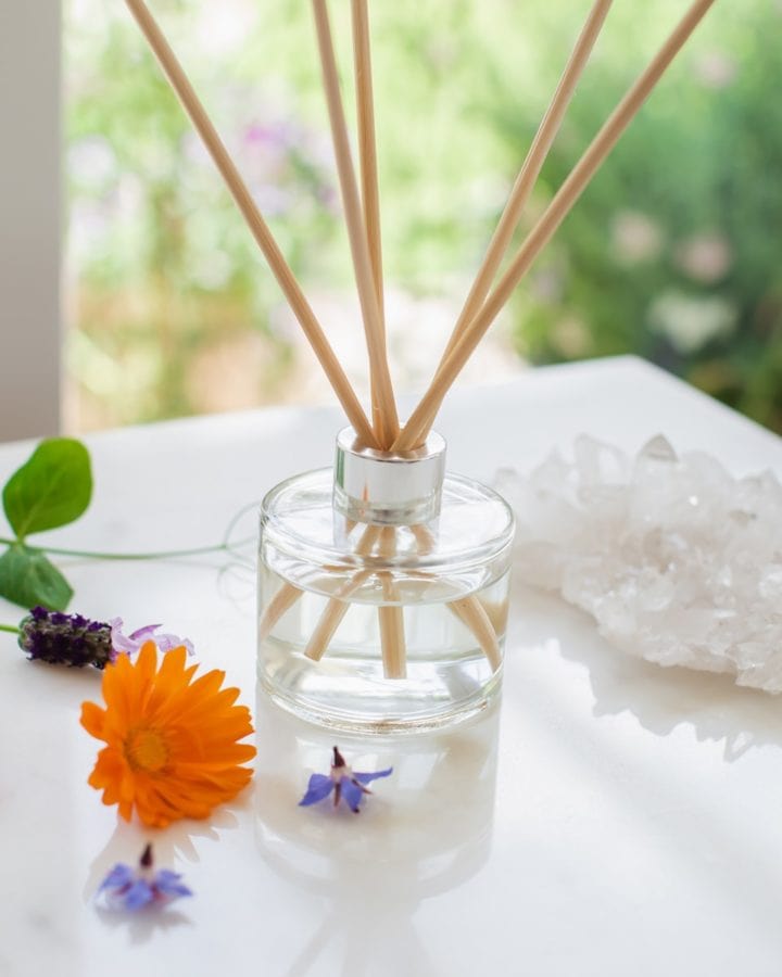 Glass reed diffuser with a stunning silver cap, filled with natural reeds.