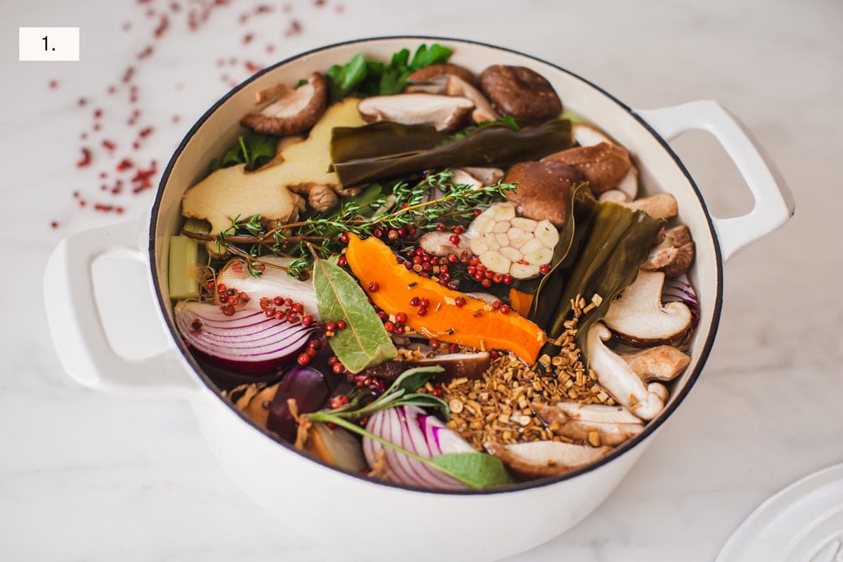 Step one showing all the prepared broth ingredients in a stock pot, covered with water.