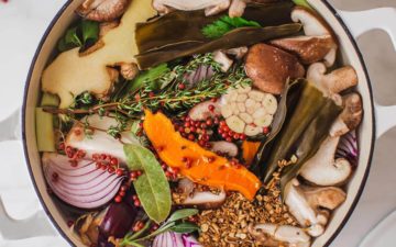 Stockpot filled with vegetables, herbs and spices
