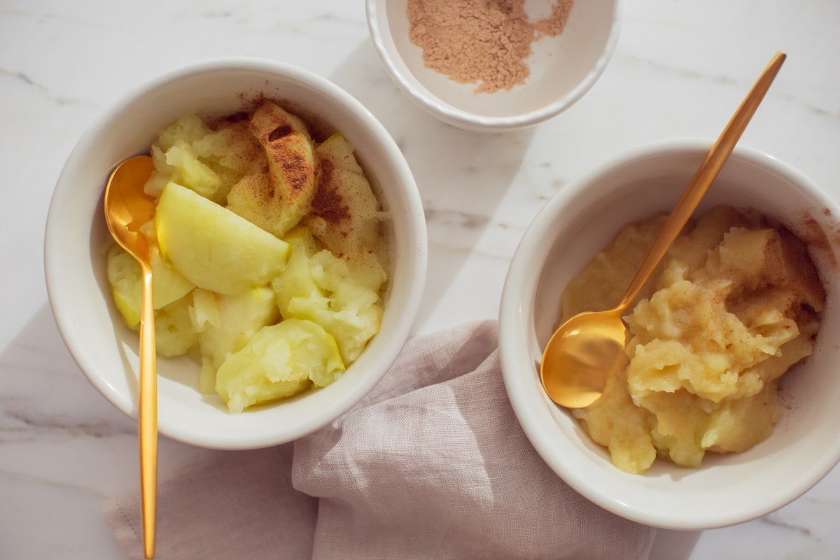 A bowl of stewed apples dusted with cinnamon on the left, and of applesauce with slippery elm on the right.