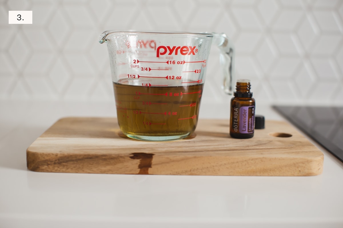 Step three, pyrex jug is removed from the heat, and essential oil of lavender is added right before pouring.