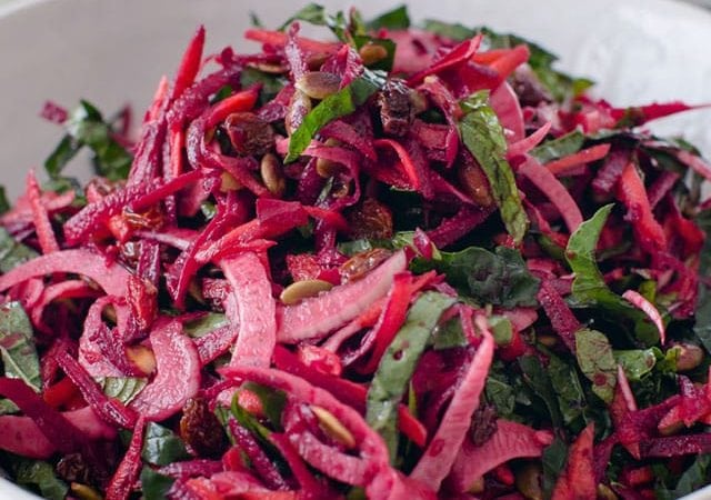 Vibrant raw beet salad in a bowl