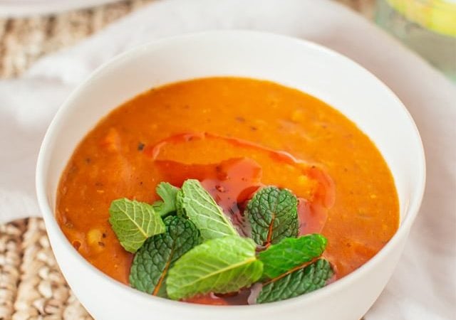 Hero shot of a delicious bowl of bright orange Turkish lentil soup