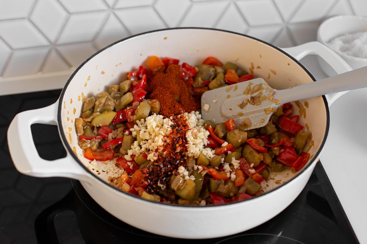 Freshly minced garlic, dried chili flakes and paprika powder added to the vegetables