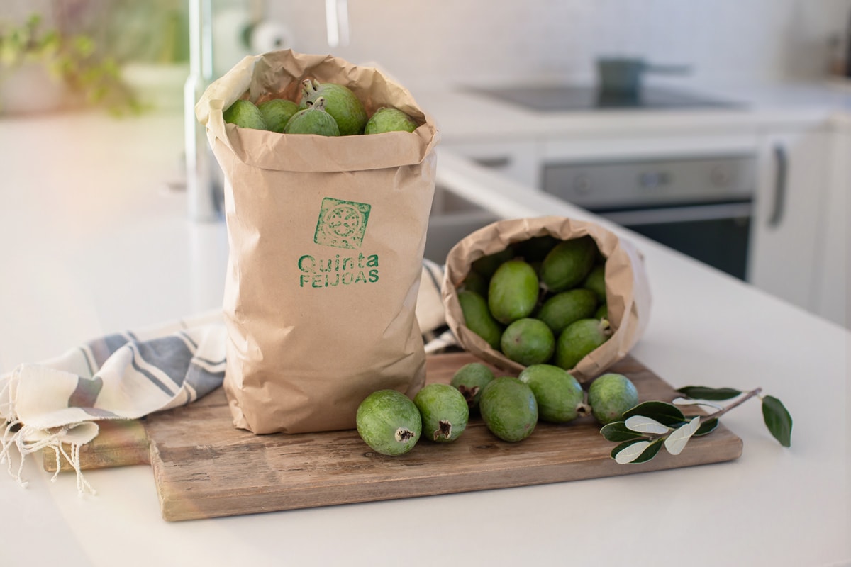 Two bags filled with Quinta Feijoas on the kitchen bench - they look plump and juicy