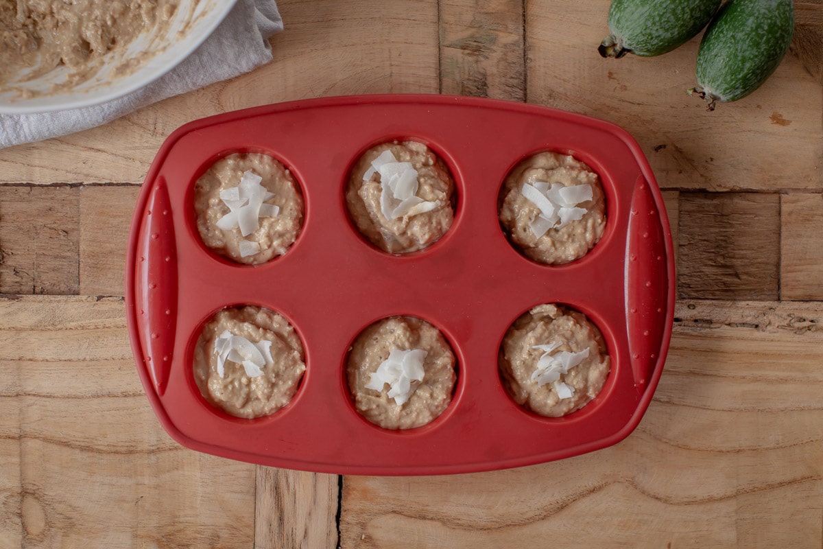 A silicon muffin mould filled with muffin mixture ready to cook.